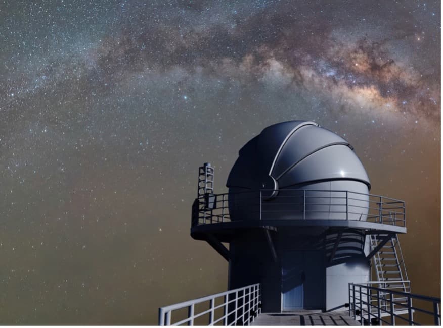 A telescope under a starry sky