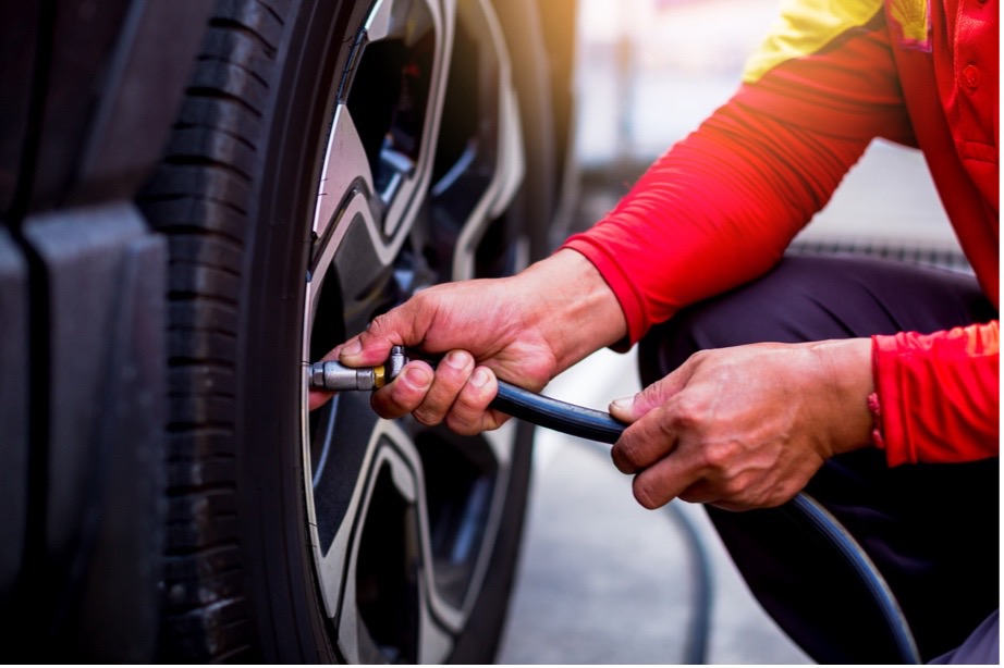 A person using a tire pump