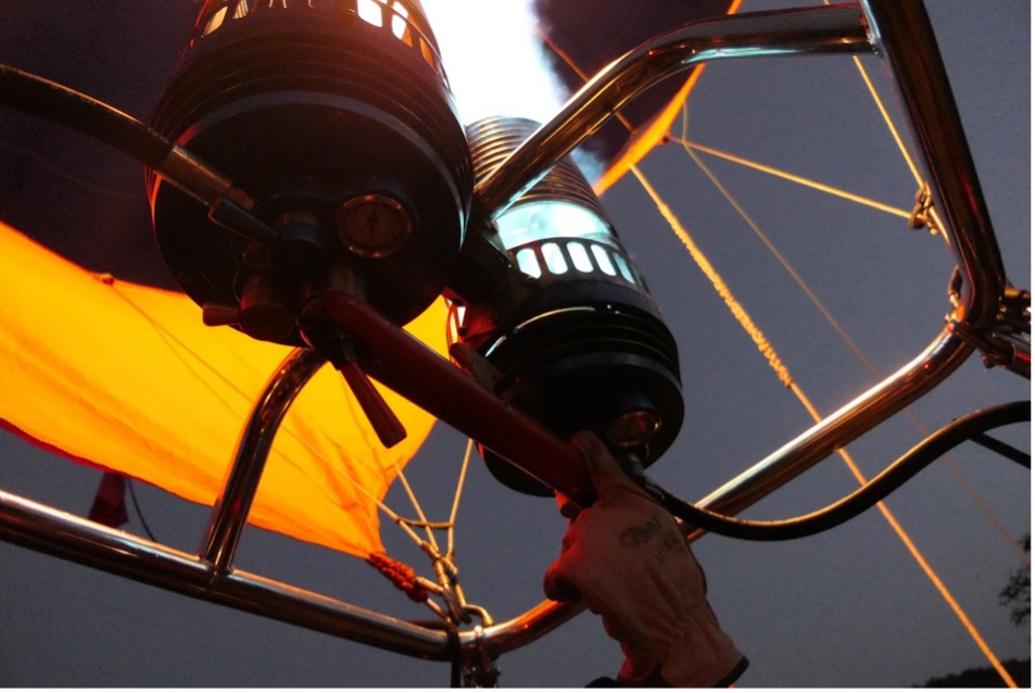 A hot air balloon with a flame